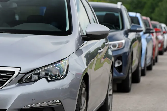 Row of cars parked on the street.