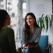Person talking to business owner.