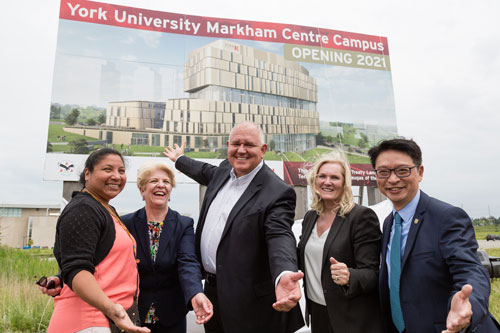 L to R: Amy Desjarlais,Traditional Knowledge Keeper; Laurel Schollen, Vice President Academic, Seneca College; Markham Mayor Frank Scarpitti; Rhonda Lenton, President and Vice-Chancellor, York University; and Billy Pang, MPP Markham-Unionville, unveil the new York University Markham Centre Campus sign at Enterprise Boulevard & Rivis Road.