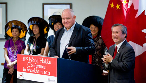 Mayor Frank Scarpitti and Regional Councillor Joe Li are joined by members of the Hakka Canadian community to announce that Markham will host the 31st World Hakka Conference in 2021.