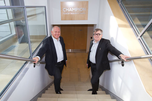 Mayor Frank Scarpitti and Mark Champion, son of Mary Champion, stand in front of the new Champion Museum Research Centre at the Markham Museum.