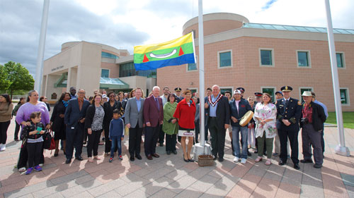 J'net Ayayqwayaksheelth and Sue Croweagle join Mayor Frank Scarpitti, Members of Council, Markham Fire and Emergency Services, City of Markham staff, York Regional Police and Markham residents to raise the Eabametoong First Nation flag at the Markham Civic Centre in honour of Indigenous History Month.